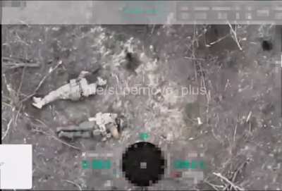 Drone drop on occupier pretending to be dead next to his comrade