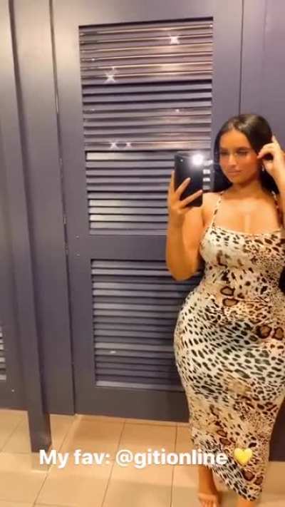 She filling out that dress and then some..