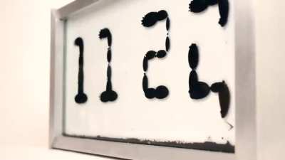 Ferrolic: a Ferrofluid Clock by Zelf Koelman