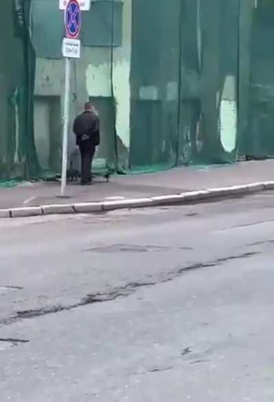 A man, a cat and a crow