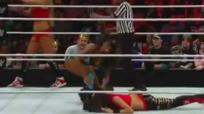 Naomi forces Brie Bella to kiss her foot.