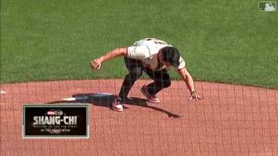 Simu throwing the first pitch for the Giants with a perfect strike and backflip