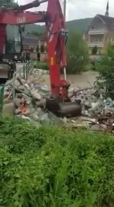 Pulling out trash from the river