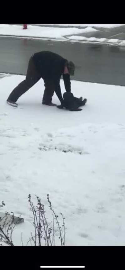 Teaching your child how to make snow angels.