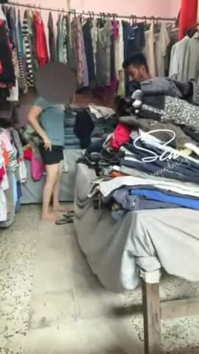 Changing Dress in Front of Shopkeeper