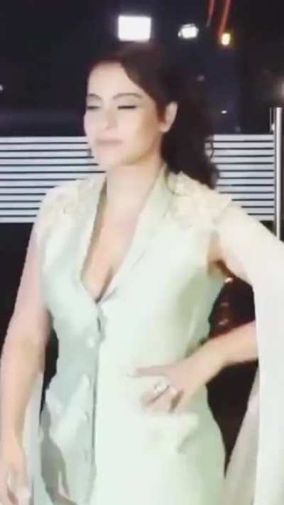 That top button is struggling to keep her tits contained
