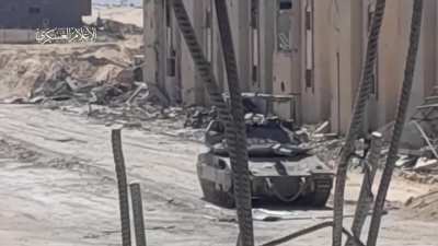 Palestinian resistance fighters blow up a tank using a guerrilla tactic