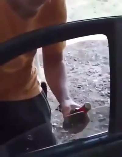 Opening a beer bottle using the car&rsquo;s window