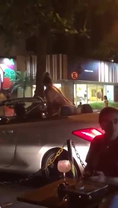 Throwing trash at a woman in a bikini