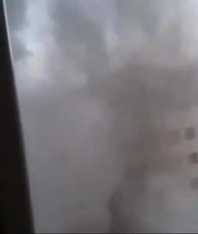 A Palestinian woman films the destruction of another apartment building, not knowing that the next strike is gonna be on where she lives.