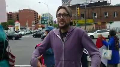 Guy spinning kicks pro-life protester mid sentence