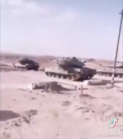 SpongeVlad passing by some army tanks