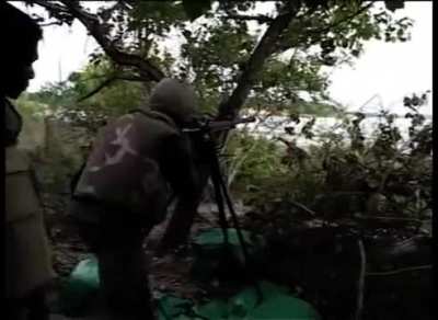 Sri Lankan army soliders using a QJC-88 heavy machine gun and a m40 recoilless rifle against ltte defensive lines.