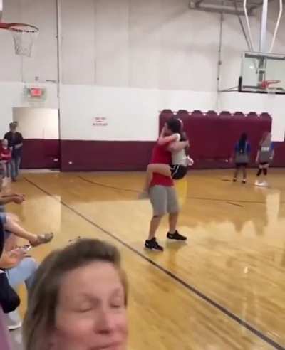 She scored her first basket and then ran to her dad to give him a hug!