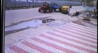 Man Flung Onto Woman Walking On The Road
