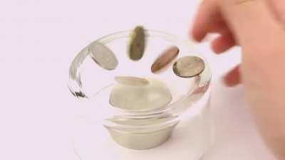 Neodymium magnet and coins