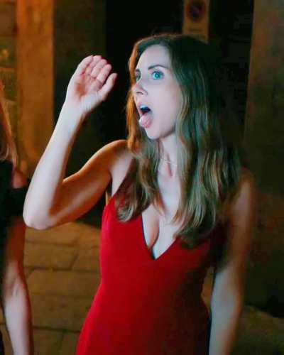 Alison Brie suggestive gesture in "Spin Me Round" (2022)