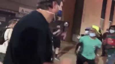 Protesters surrounding and beating journalists