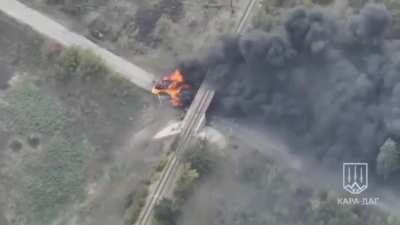Ukrainian tank rams a burning Russian BTR-82 that was obstructing passage under the railway bridge near Selidove. Kara-Dag unit