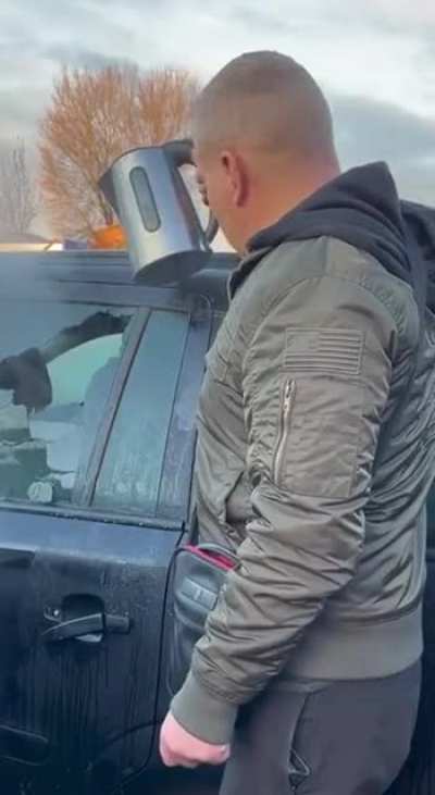 Removing ice off a car window