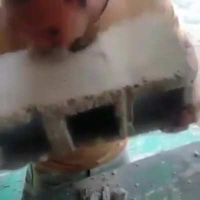 A man eating bricks