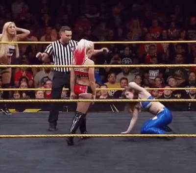 Alexa Bliss yanks the hair of Nikki Cross with a smile and crouches down to yell in her face &ldquo;Welcome to NXT Nikki!&rdquo;