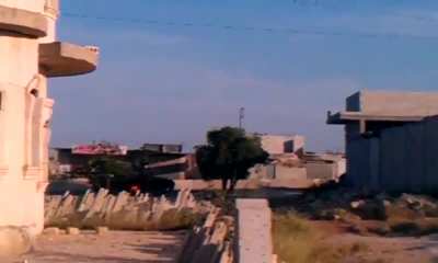 Early-war FSA fighter engages a presumably abandoned/disabled Syrian Army tank with an RPG - Azaz - May 2012