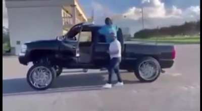 What could go wrong while dancing beside a half lifted pickup truck?