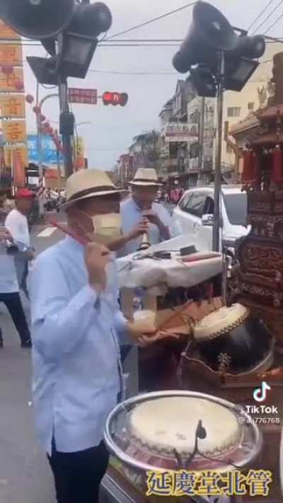 In Taiwan, gods go on patrol accompanied by the Temple's band.