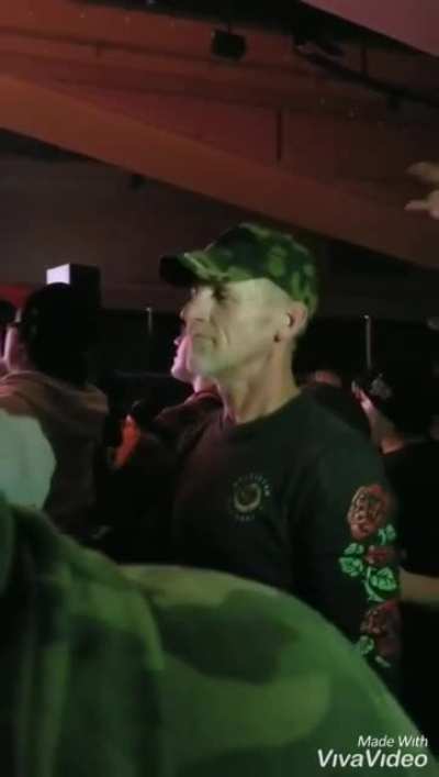 Daughter signing for her father at a rock concert