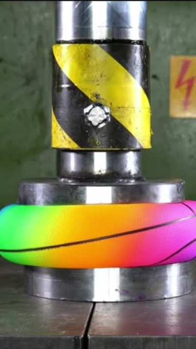 A ball under a hydraulic press