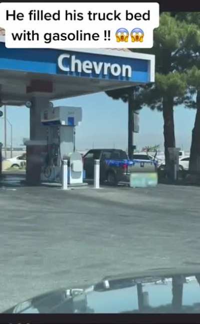 Part 2 of the guy filling up his truck bed with gasoline.
