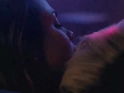 Riley Voelkel giving Monica Raymund a lap dance