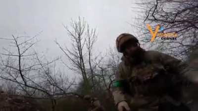Evacuation of Ukrainian soldiers from the battlefield with a HUMVEE armored car, under artillery shelling.