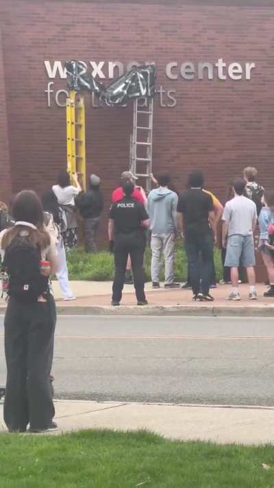 Students 'redact' sign for Wexner Center for the Arts