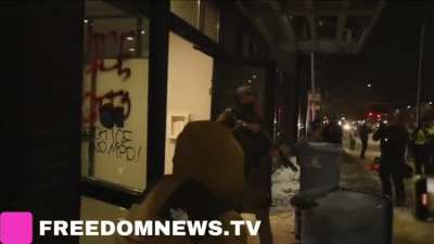 Chaos at a Minneapolis hotel housing ICE as a Federal Agent open fires on community members with a 12ga shotgun. At least one round is fired in-between volleys of tear gas. Agents claim the rounds are “not live” but that is something that doesn’t exist. (