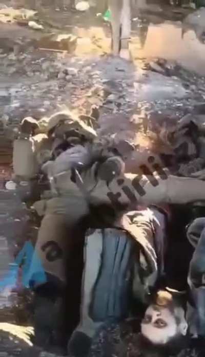 Ukrainian soldiers showing Russian bodies in Luhansk, 8 January 2023