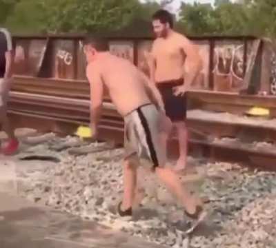 Guy tries to run and jump into a river but doesn&rsquo;t see the boat until after he jumps, even though his friends try to warn him.