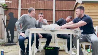 Four dudes trying to open a can of Surstr&ouml;mming