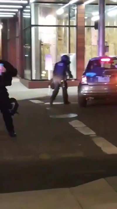 Cops spray painting on cars just because.