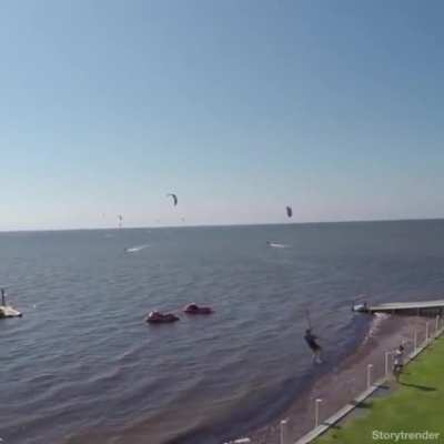 Kitesurfing with a jump from a balcony.