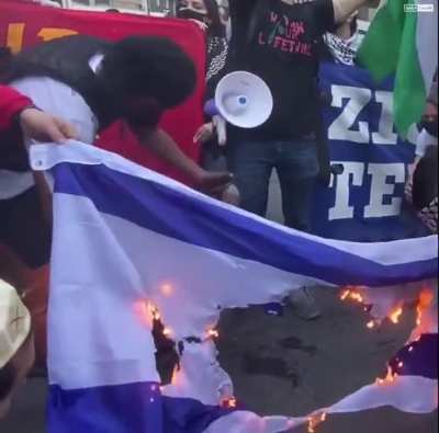 Israel flag burns in New York as peaceful protestors chant "Israel go to hell"