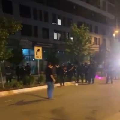 Man walks up to police stays a distance away an officer pepper sprays him followed by another shooting him point blank with a flash bang canister