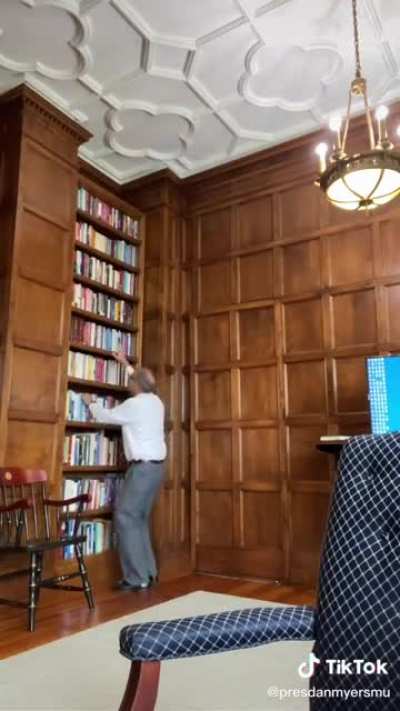 University President Can't Reach His Books