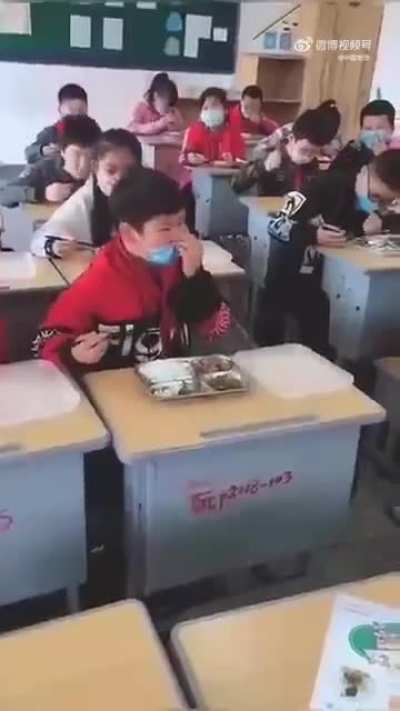 Students must wear masks when eating at school.