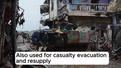 Armor ops in the tight streets of Marawi, featuring improvised and decked out armor and up-armored dozers.