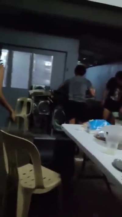 WCGR holding on to a karaoke machine while doing a split