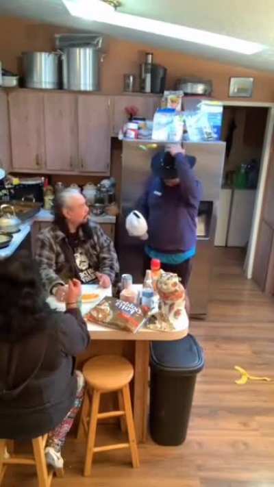 Taking dads hat off of his head