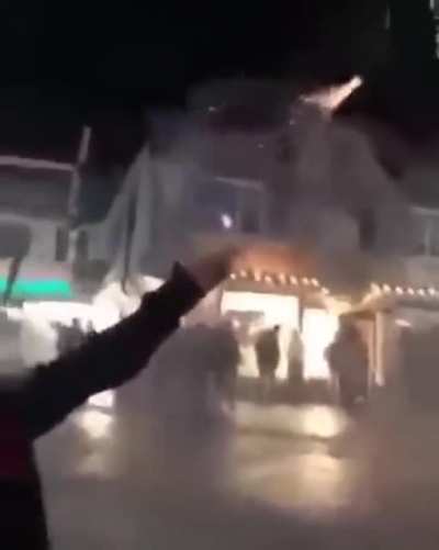 This was a huge gathering by these people and then these two women were learning how to set off fireworks: No one walked out uninjured from the crowd, even though most injuries were superficial