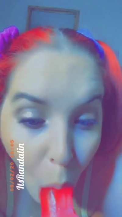 The queen sucking on dildo